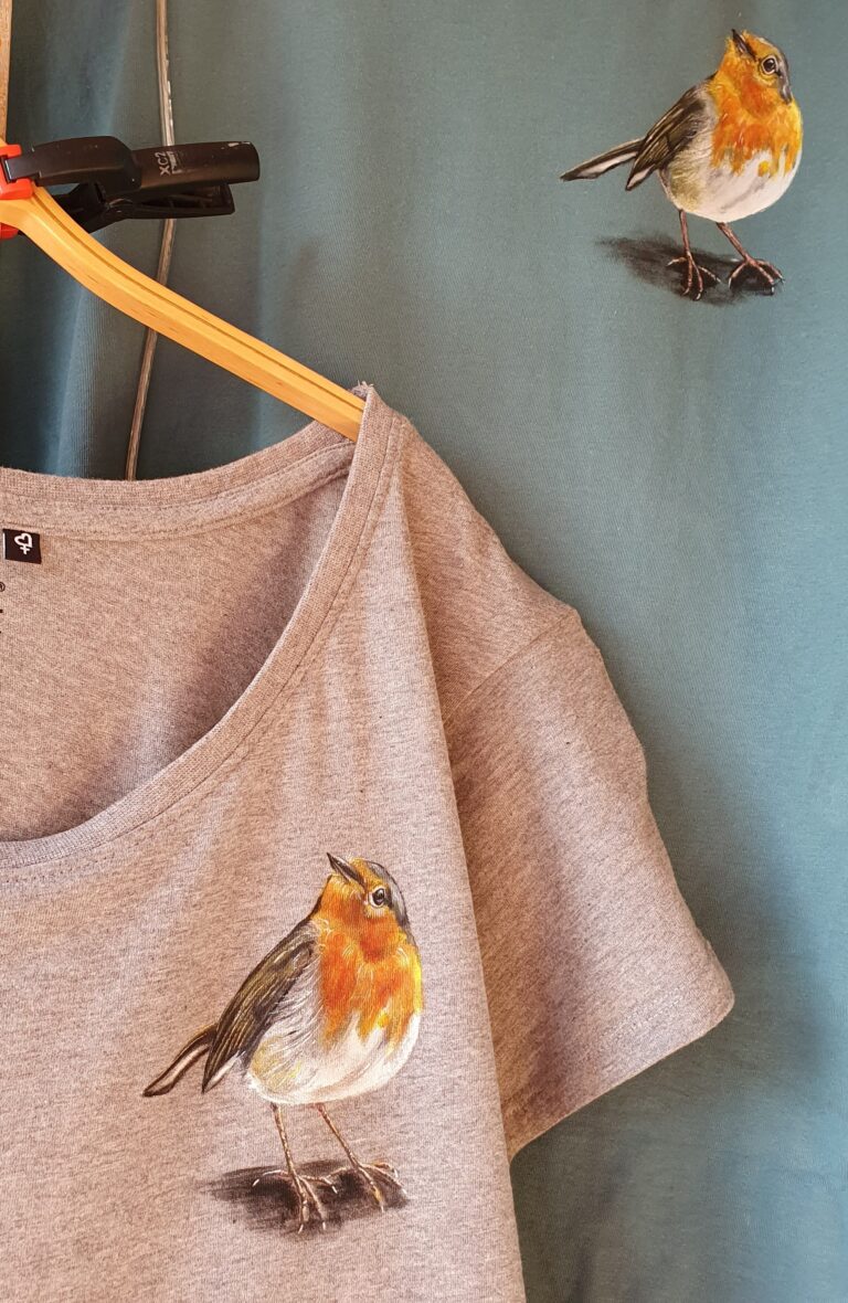 Hand-painted bird on a T-shirt